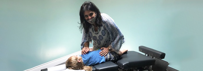 Chiropractor Yonge and St. Clair in Toronto ON Salima Manji Adjusting Child Patient
